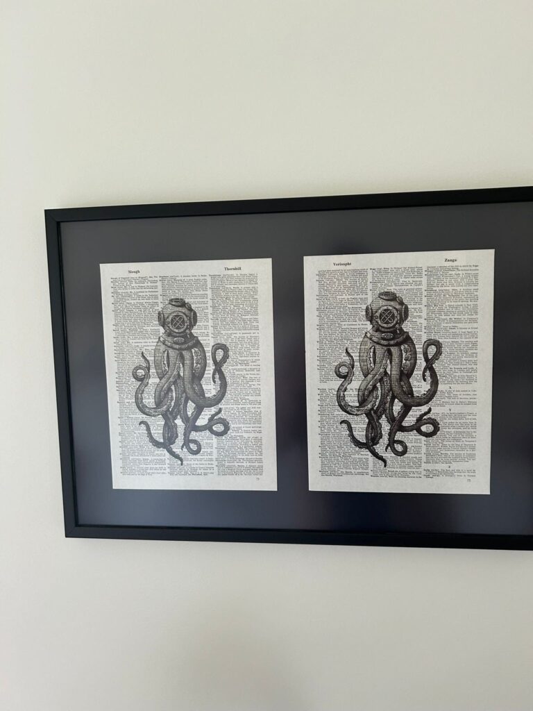 Two pages of a book with an ink drawing of a squid overlaid on top.