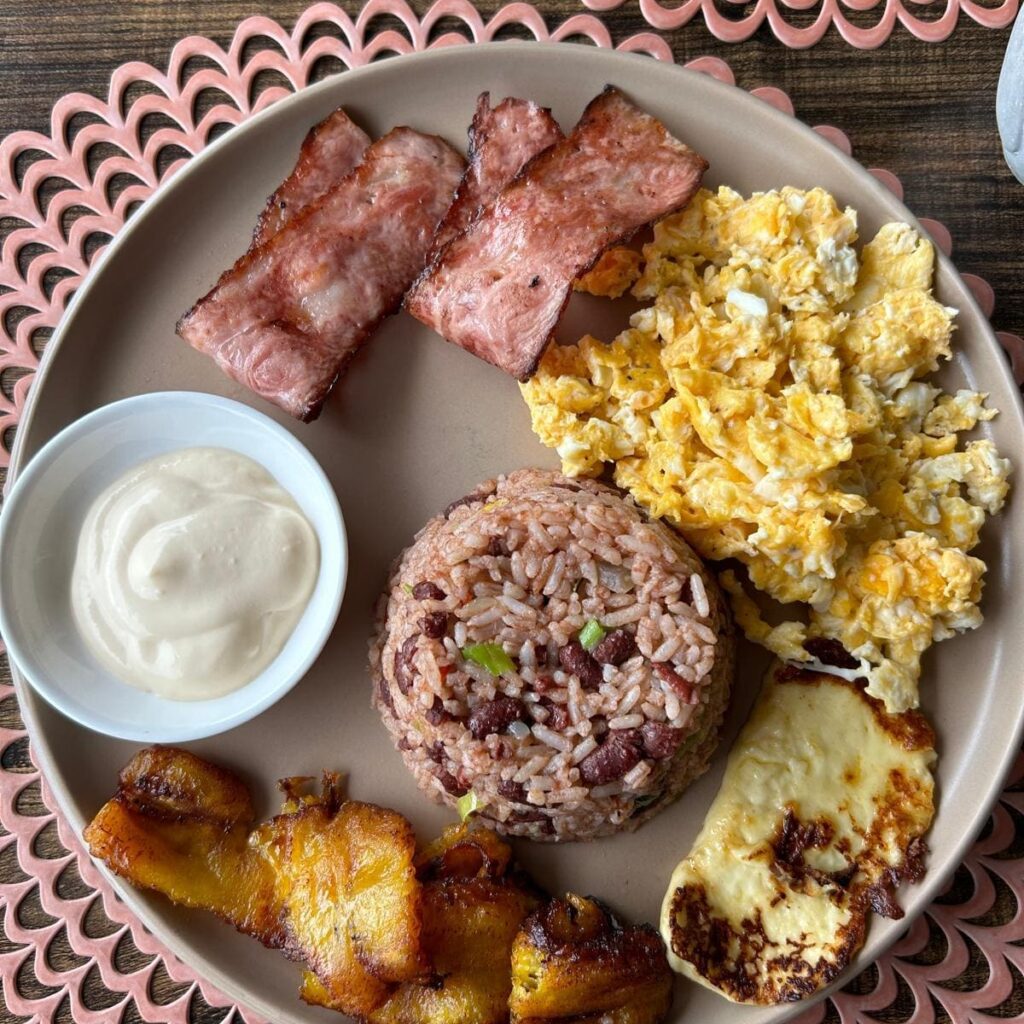 Bacon, eggs, cream, rice and beans, fried cheese and plantains.
